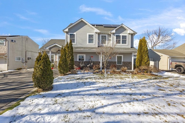 view of front of home with solar panels