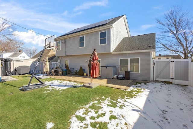 back of house featuring a lawn and a patio area