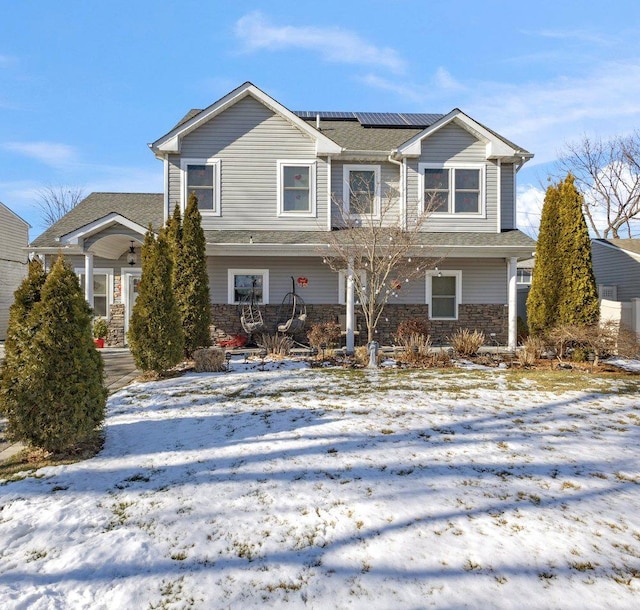 view of front of house with solar panels