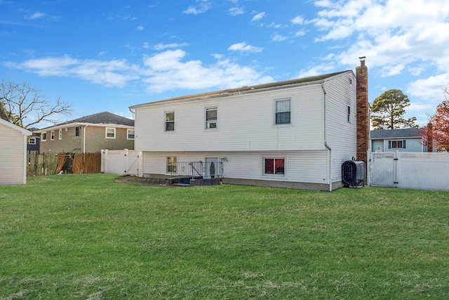 back of house with a yard