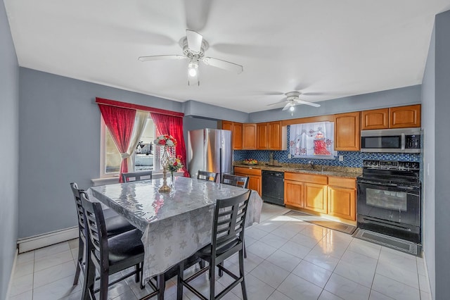 kitchen with light tile patterned flooring, sink, tasteful backsplash, a baseboard radiator, and black appliances