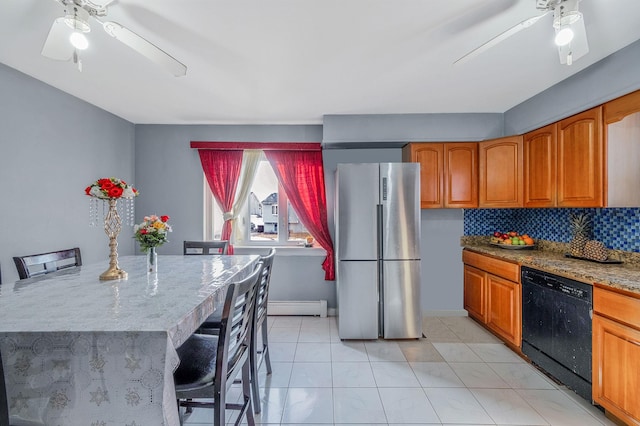 kitchen featuring a baseboard radiator, black dishwasher, a breakfast bar area, and stainless steel refrigerator