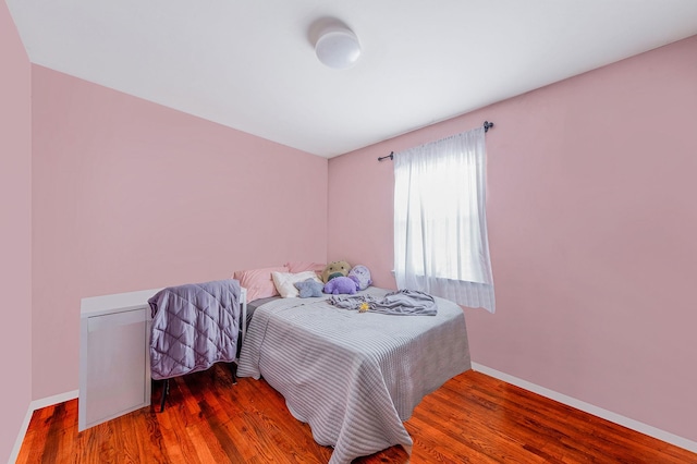 bedroom featuring dark hardwood / wood-style flooring