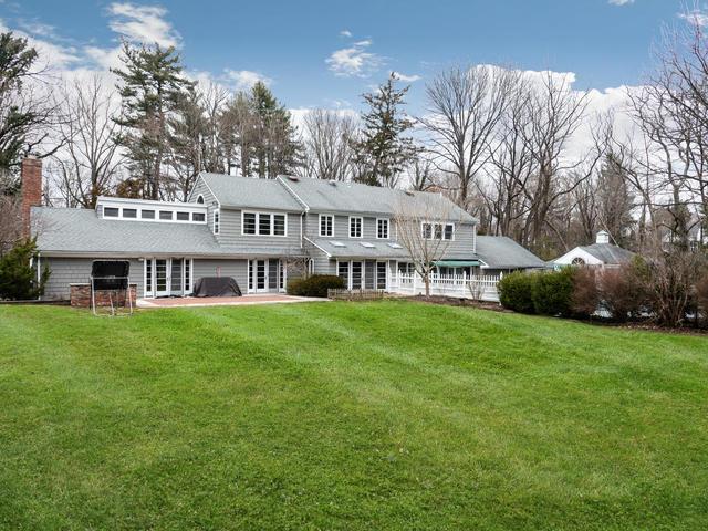 rear view of property with a patio area and a lawn