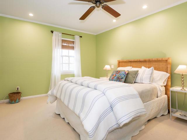 bedroom featuring ornamental molding, ceiling fan, and carpet flooring