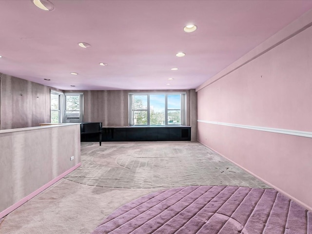 interior space featuring light carpet and a wealth of natural light