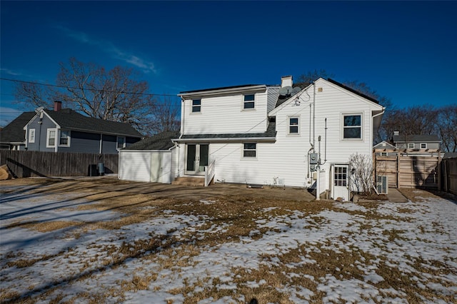 view of snow covered house