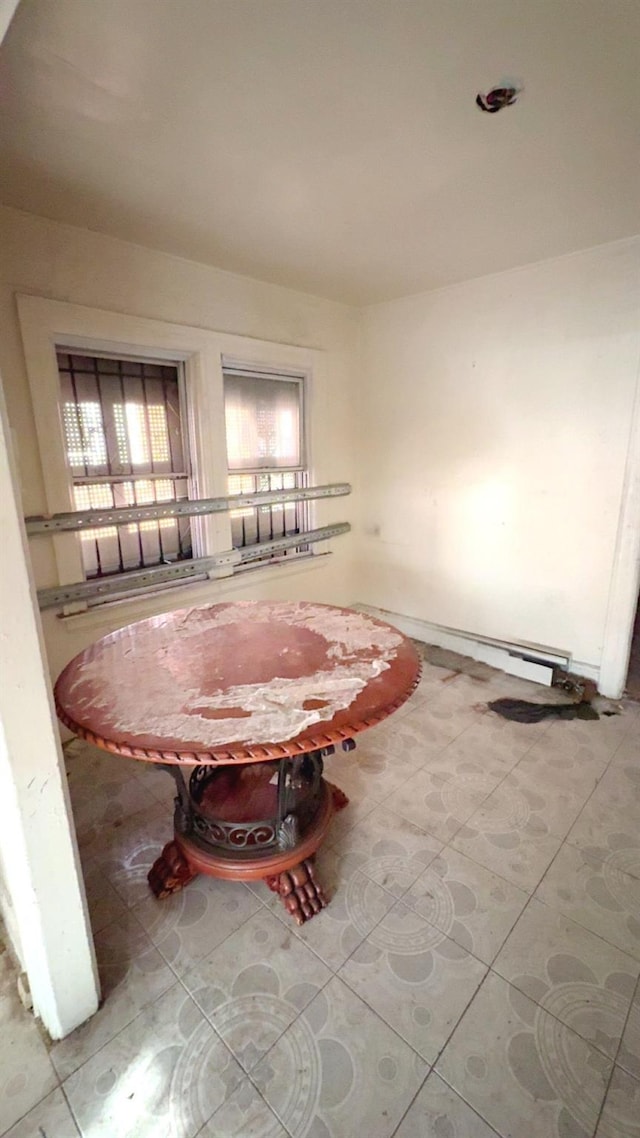 unfurnished dining area featuring tile patterned flooring