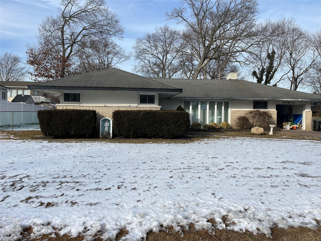 view of snow covered house