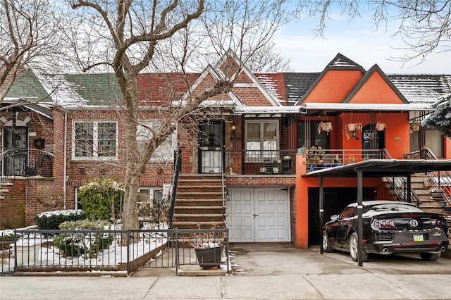 view of front of house with a garage and a carport