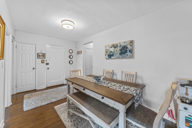 dining room with dark wood-style floors