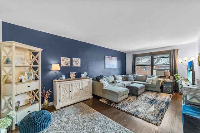 living area with cooling unit and dark wood-style flooring