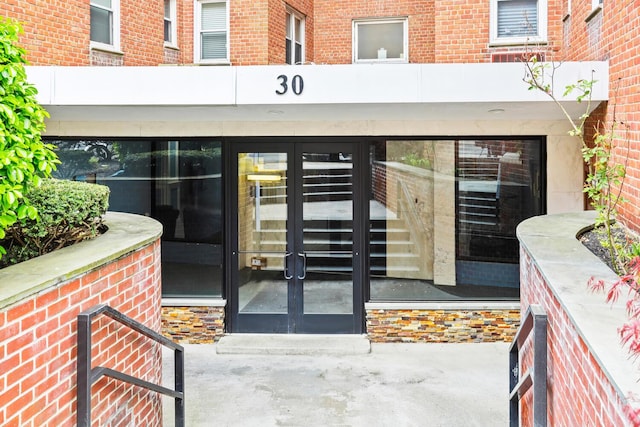 view of exterior entry featuring french doors