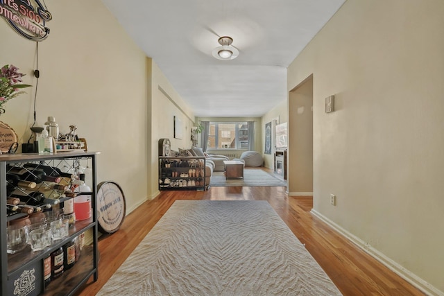 corridor with hardwood / wood-style floors