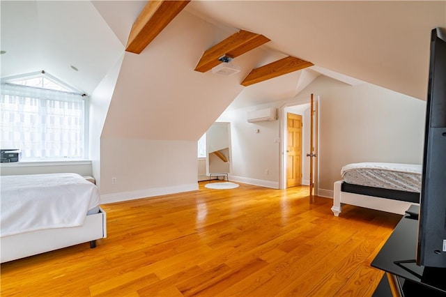 bedroom featuring wood-type flooring, lofted ceiling with beams, and an AC wall unit