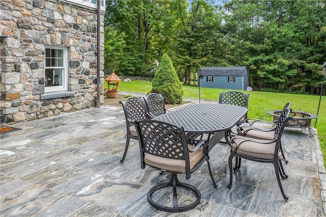 view of patio with a shed