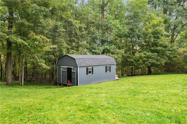 view of outdoor structure with a lawn