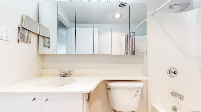 full bathroom with shower / bath combo, vanity, and toilet