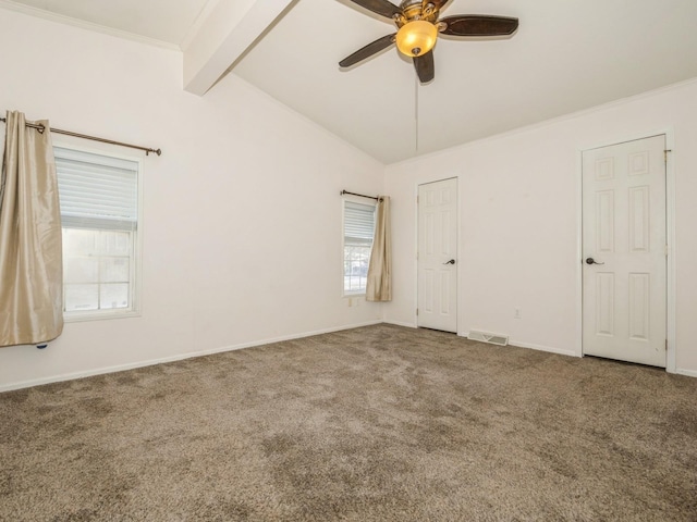 carpeted empty room with ornamental molding, vaulted ceiling with beams, and ceiling fan