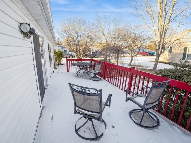 view of snow covered deck