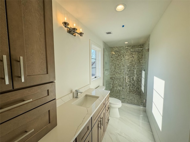 bathroom with walk in shower, vanity, and toilet