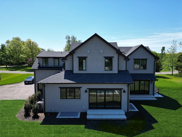 2045 Willow Dr, East Marion, NY 11939 - back of house with stucco siding, a yard, a shingled roof, and entry steps