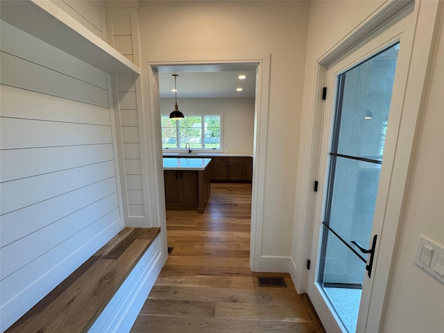 2045 Willow Dr, East Marion, NY 11939 - hall with dark wood-style floors, a sink, baseboards, and recessed lighting