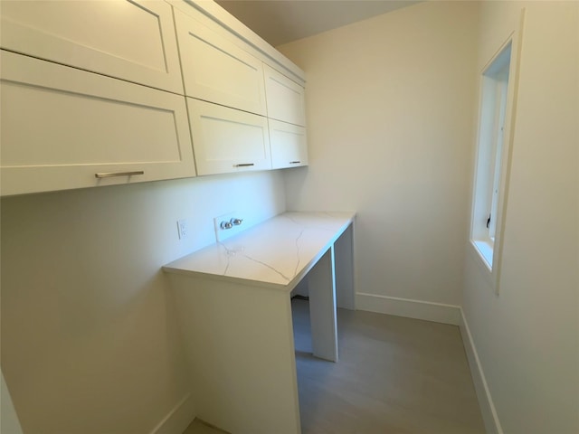 2045 Willow Dr, East Marion, NY 11939 - laundry room featuring baseboards