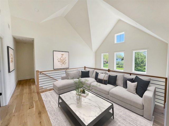 2045 Willow Dr, East Marion, NY 11939 - living area with high vaulted ceiling and light wood-style floors
