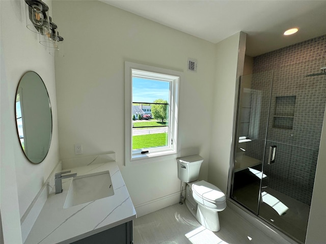 2045 Willow Dr, East Marion, NY 11939 - bathroom featuring vanity, toilet, a stall shower, baseboards, and recessed lighting