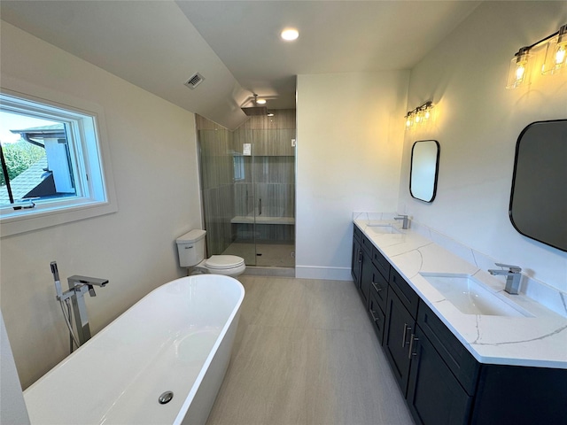 2045 Willow Dr, East Marion, NY 11939 - full bathroom with a shower stall, a soaking tub, double vanity, toilet, and recessed lighting