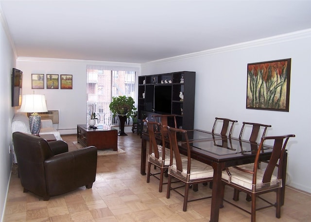 dining room with light parquet flooring, crown molding, and a baseboard radiator