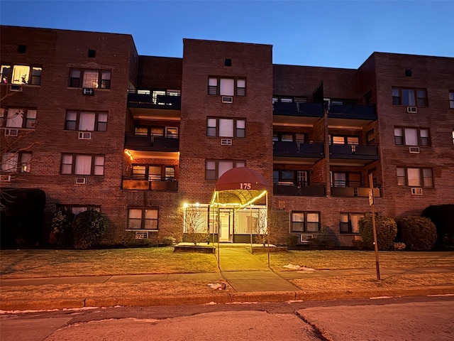 view of outdoor building at dusk