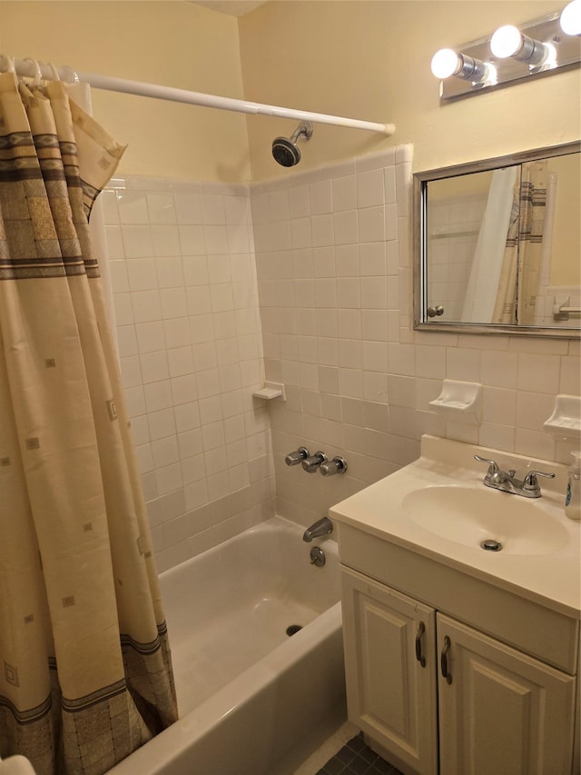 bathroom featuring vanity, tile walls, shower / bathtub combination with curtain, and decorative backsplash