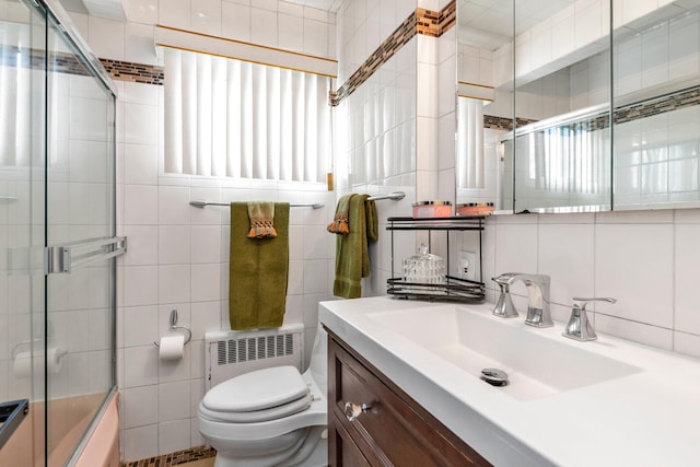 full bathroom with radiator heating unit, tile walls, and vanity