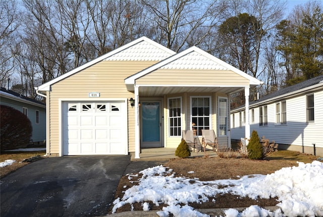 view of front of home with a garage and covered porch