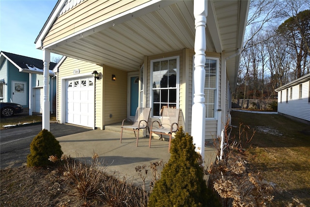 exterior space featuring a garage and a porch