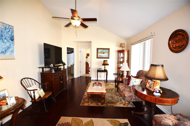 living room featuring vaulted ceiling, dark hardwood / wood-style floors, and ceiling fan