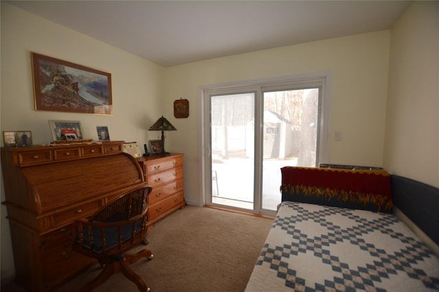 bedroom featuring light carpet and access to exterior