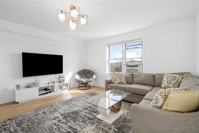 living room with cooling unit and wood-type flooring