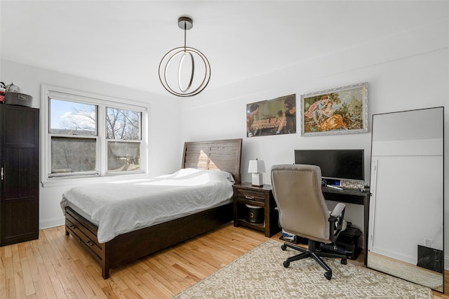 bedroom with light wood-type flooring