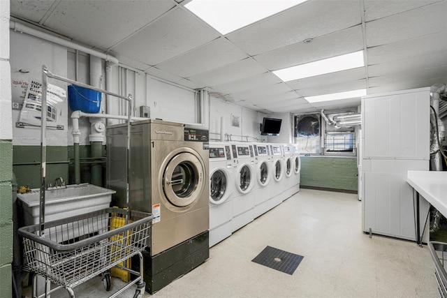 clothes washing area with washer and dryer