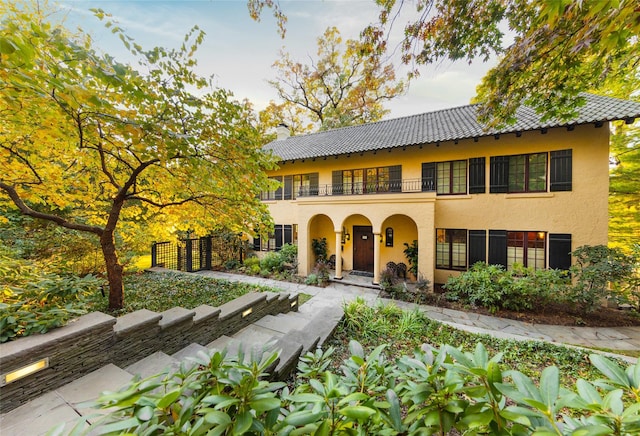 view of front of home with a balcony