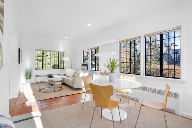 interior space featuring recessed lighting, baseboards, radiator heating unit, and light tile patterned floors