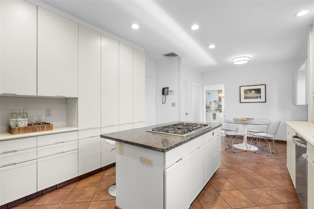 kitchen featuring white cabinetry, appliances with stainless steel finishes, and tile patterned flooring