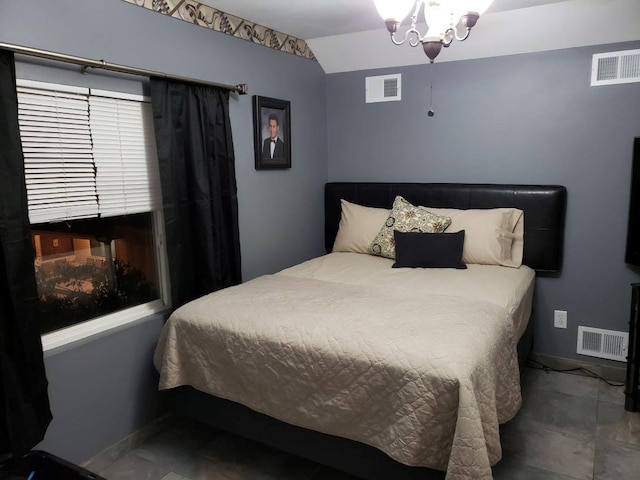 bedroom with vaulted ceiling and a chandelier