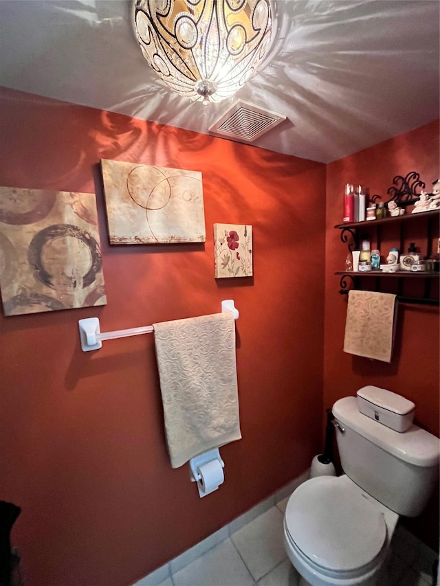 bathroom with tile patterned flooring and toilet