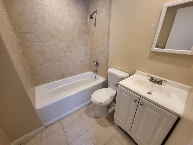 full bathroom featuring vanity, tiled shower / bath combo, tile patterned floors, and toilet