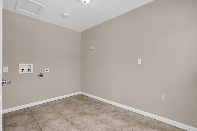 washroom featuring hookup for an electric dryer, hookup for a washing machine, and light tile patterned floors