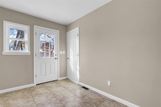 foyer entrance featuring light tile patterned floors